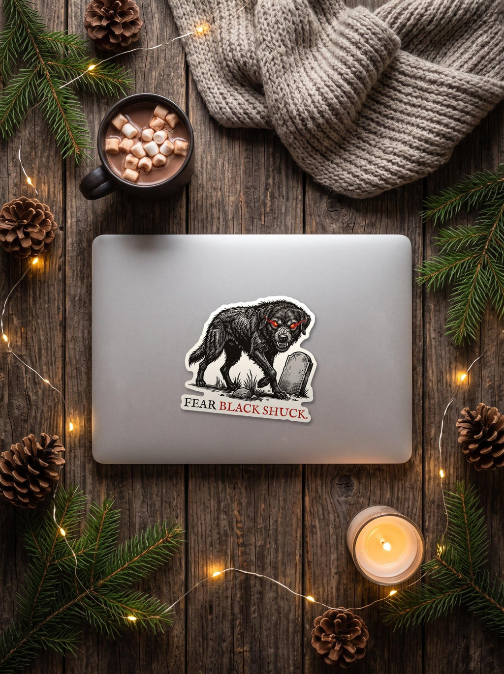Black Shuck die-cut sticker on a laptop, Forget The Pumpkin by Wispling Press
