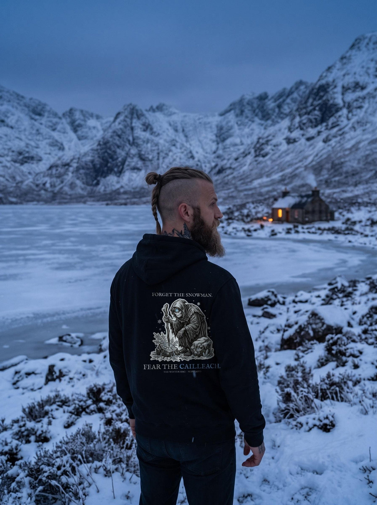 Cailleach hoodie worn in a winter scene, showing the big back print